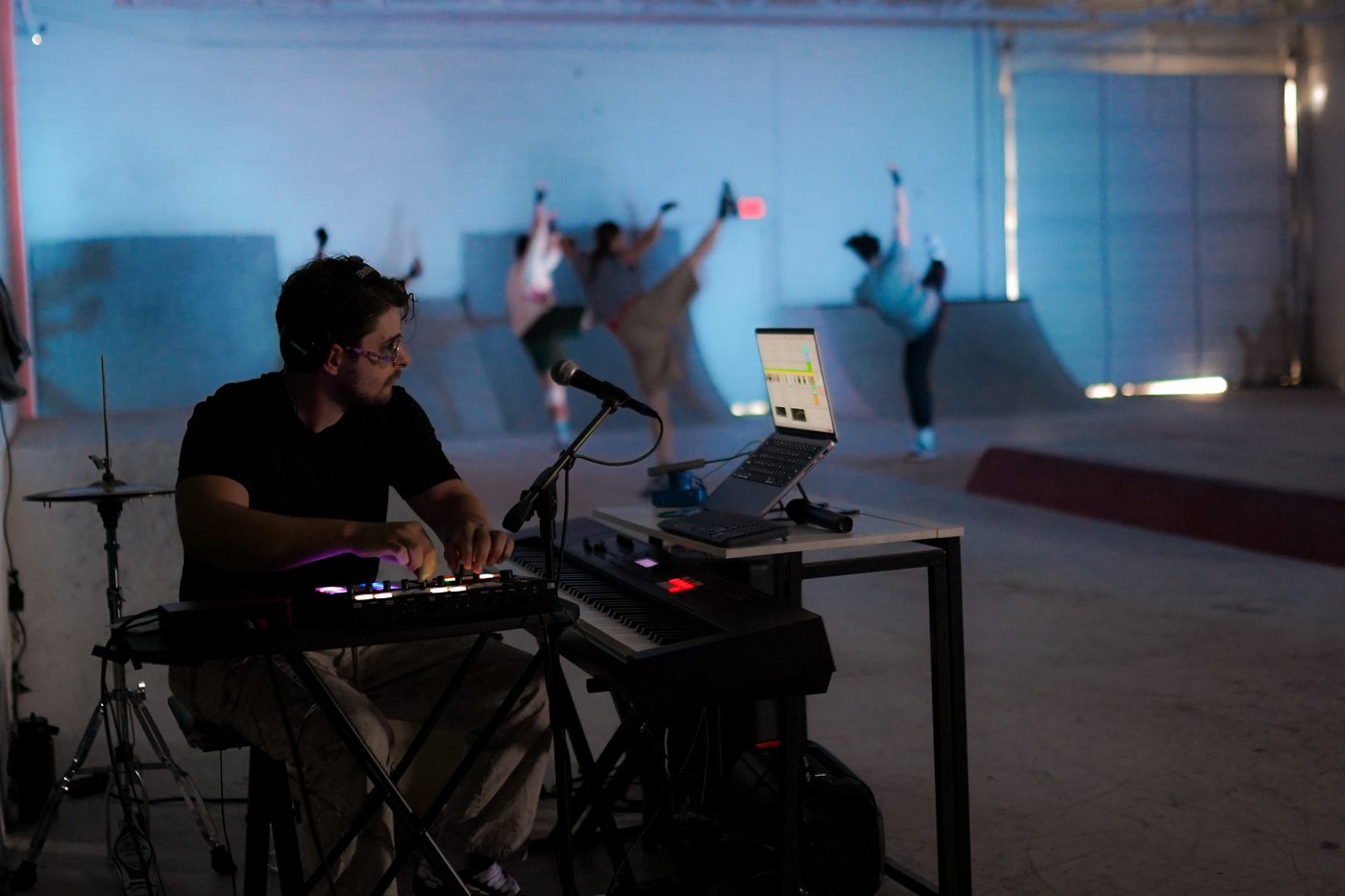 William Labossiere composing live while dancers rehearse